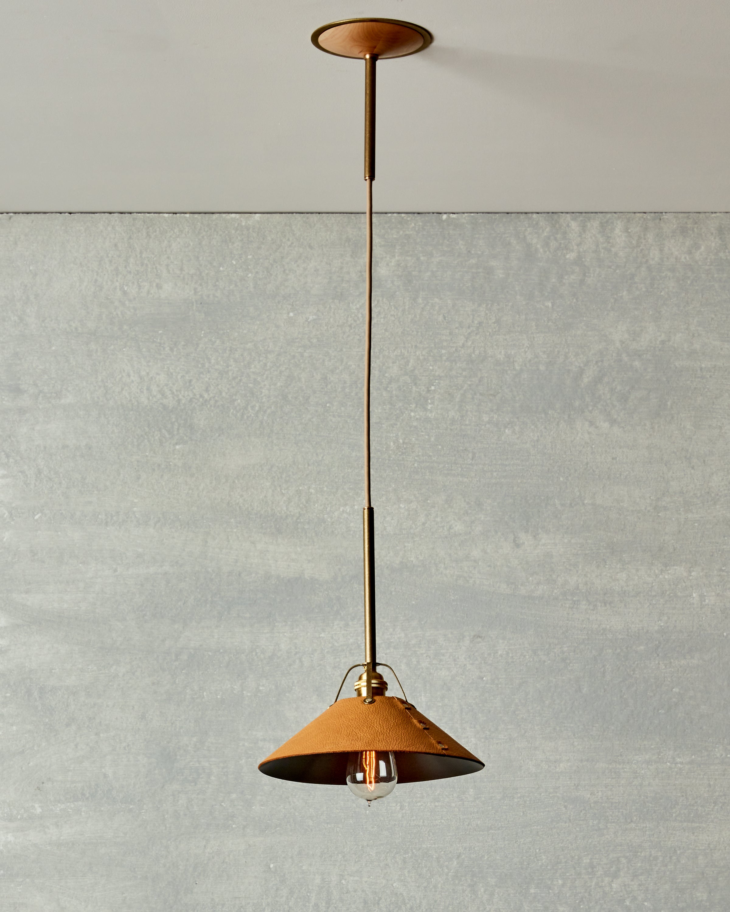 Robert True Ogden RTO Lighting - Medium Yaffa Pendant - Tumbled Brass Half Poles - Natural Leather Shade Natural Oak Canopy#leather-shade_natural