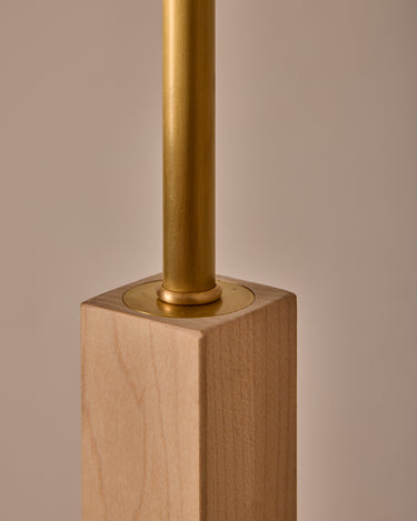 Close-up of a lamp with brass fitting on a wooden base against a beige background

Robert True Ogden RTO Lighting Anouck Floor Lamp  - Clear Maple#wood-finish_clear-maple