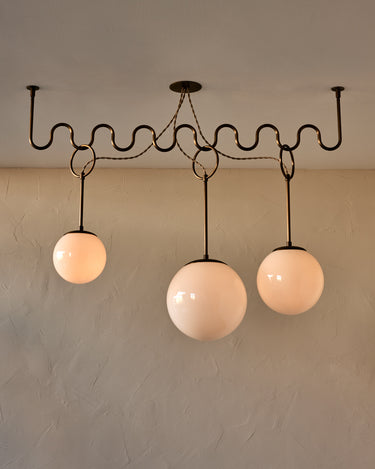 Robert True Ogden RTO Lighting 50" Cecil Adjustable Ceiling Light Chandelier - Antique Brass - Once 8 Inch, One 10 Inch, and One 12 Inch Milk Glass Globes#finish-glass-globe_antique-brass-milk-glass-globe