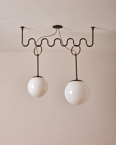 Robert True Ogden RTO Lighting 36" Cecil Adjustable Ceiling Light Chandelier - Antique Brass - One 12 Inch and Once 10 Inch Milk Glass Globes#finish_antique-brass