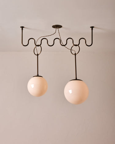 Robert True Ogden RTO Lighting 36" Cecil Adjustable Ceiling Light Chandelier - Antique Brass - One 12 Inch and Once 10 Inch Milk Glass Globes#finish_antique-brass
