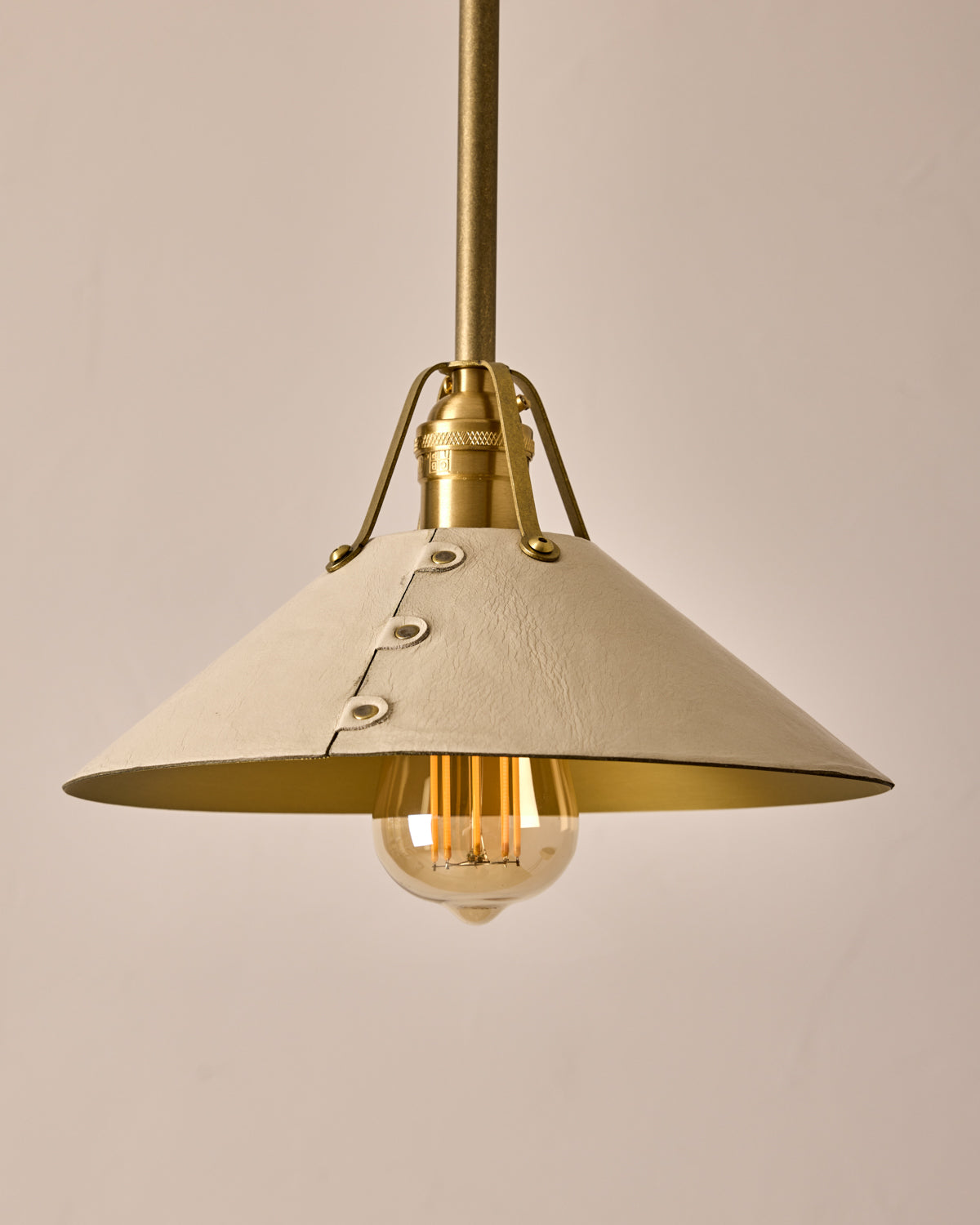 Robert True Ogden RTO Lighting - Medium Yaffa Pendant -Tumbled Brass Half Poles - Eggshell Leather Shade Natural Oak Canopy#leather-shade_eggshell-leather