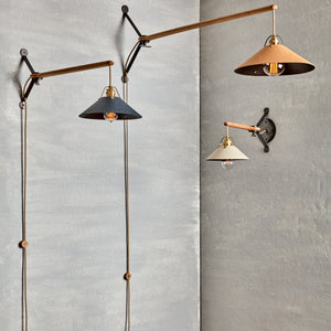 Robert True Ogden RTO Lighting - Group of Three Yaffa Swing Arm Sconces - One Hardwired Small Eggshell Leather Shade - One Plug In Large Natural Leather Shade - One Plug In Medium Navy Leather Shade